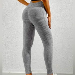 Gray, textured pants with a slit at the ankle. Size Large; Fits like a medium.